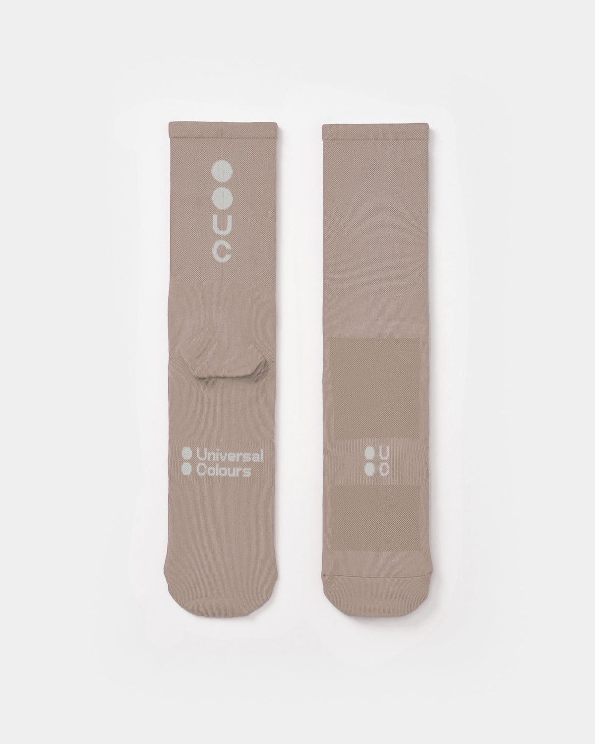 Flatlay of the Mono Summer Socks in Moon Rock: vertical UC logo on the cuff, horizontal UC mark on the foot.