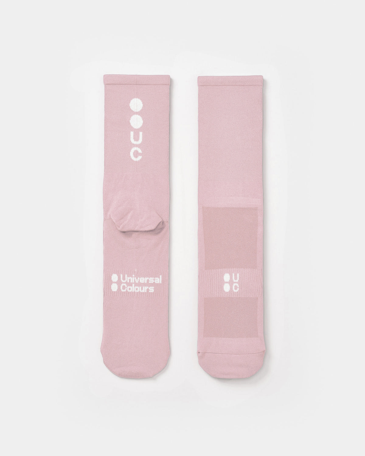Flatlay of the Mono Summer Socks in Washed Pink: vertical UC logo on the cuff, horizontal UC mark on the foot.