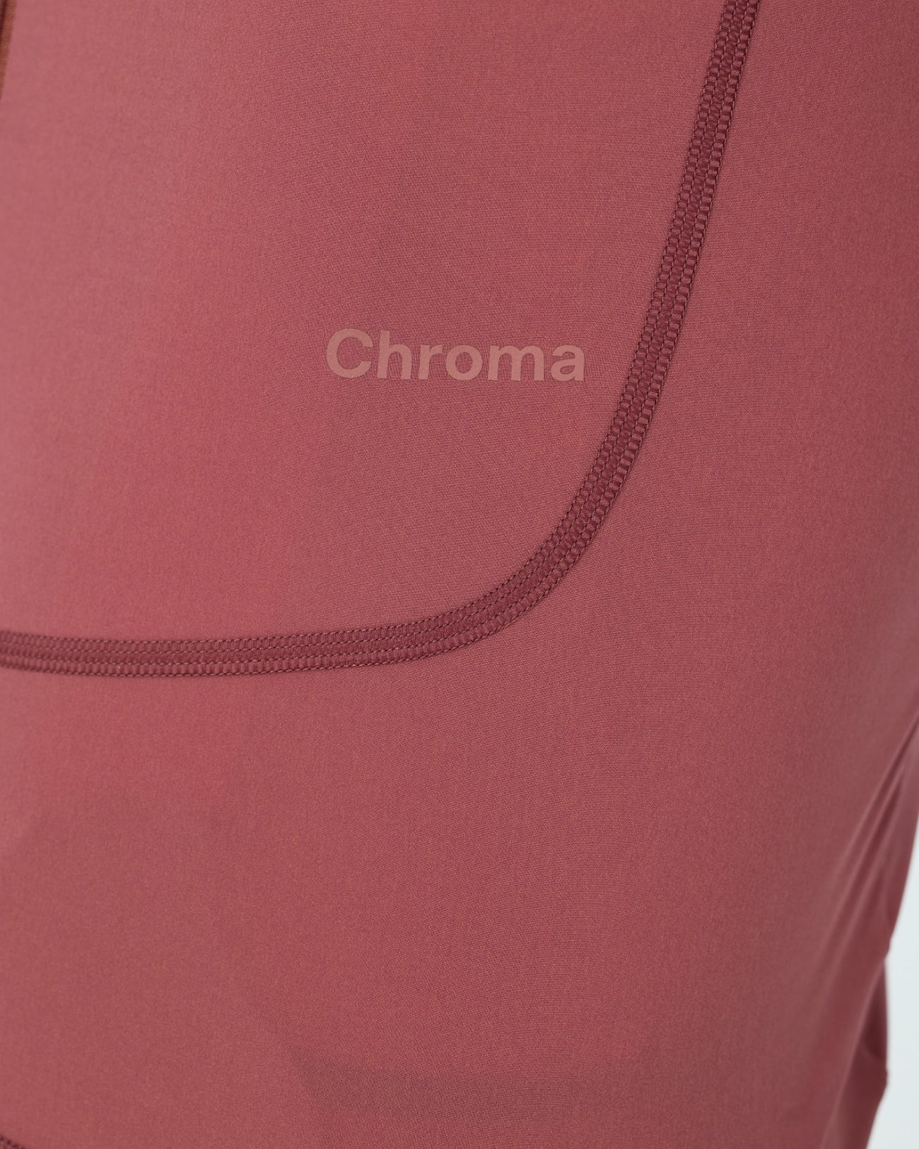 Close-up of the tonal Chroma back-hem print and curved overlock seam on the Men's Chroma Jersey in Jaipur Red.