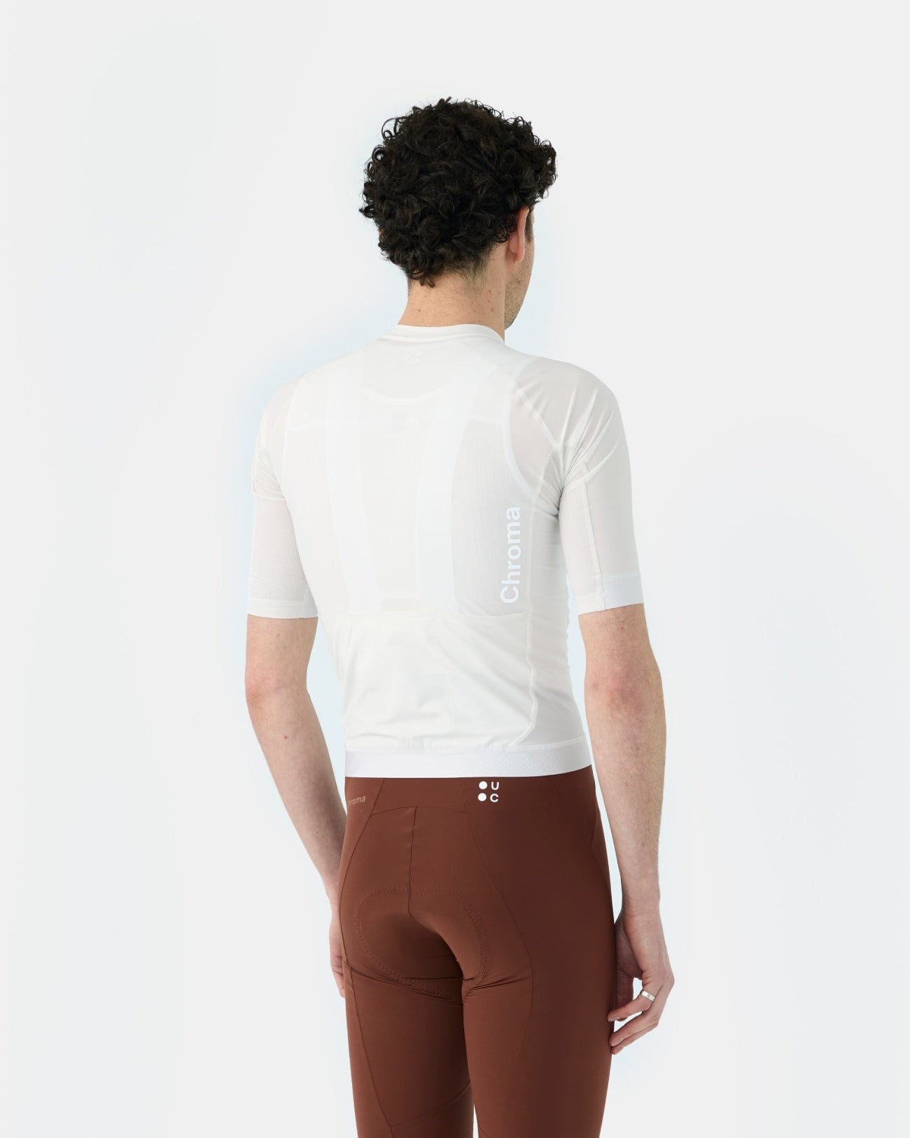 Back view: Men's Chroma Short Sleeve Jersey in Off White, sheer mesh back panel with tonal side Chroma wordmark.