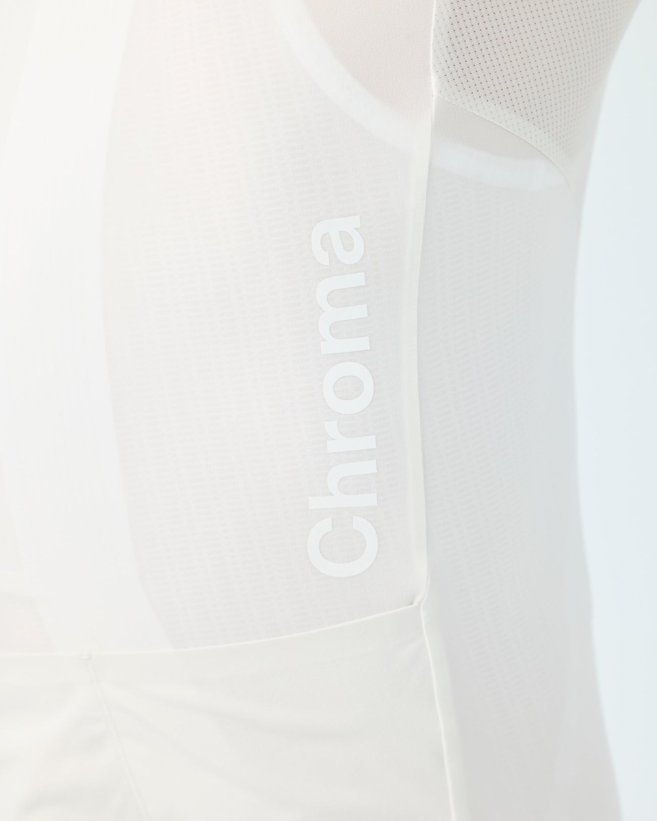 Side panel close-up: tonal vertical Chroma wordmark on the perforated mesh side of the Off White Chroma jersey.