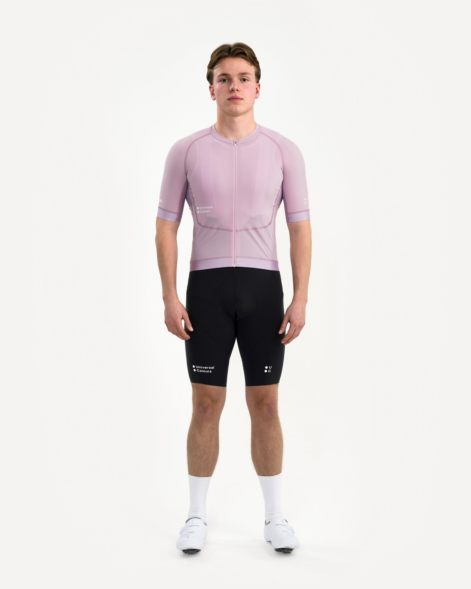 Model wearing the Men's Chroma Short Sleeve Jersey in Washed Lilac, front view, styled with branded UC bib shorts.