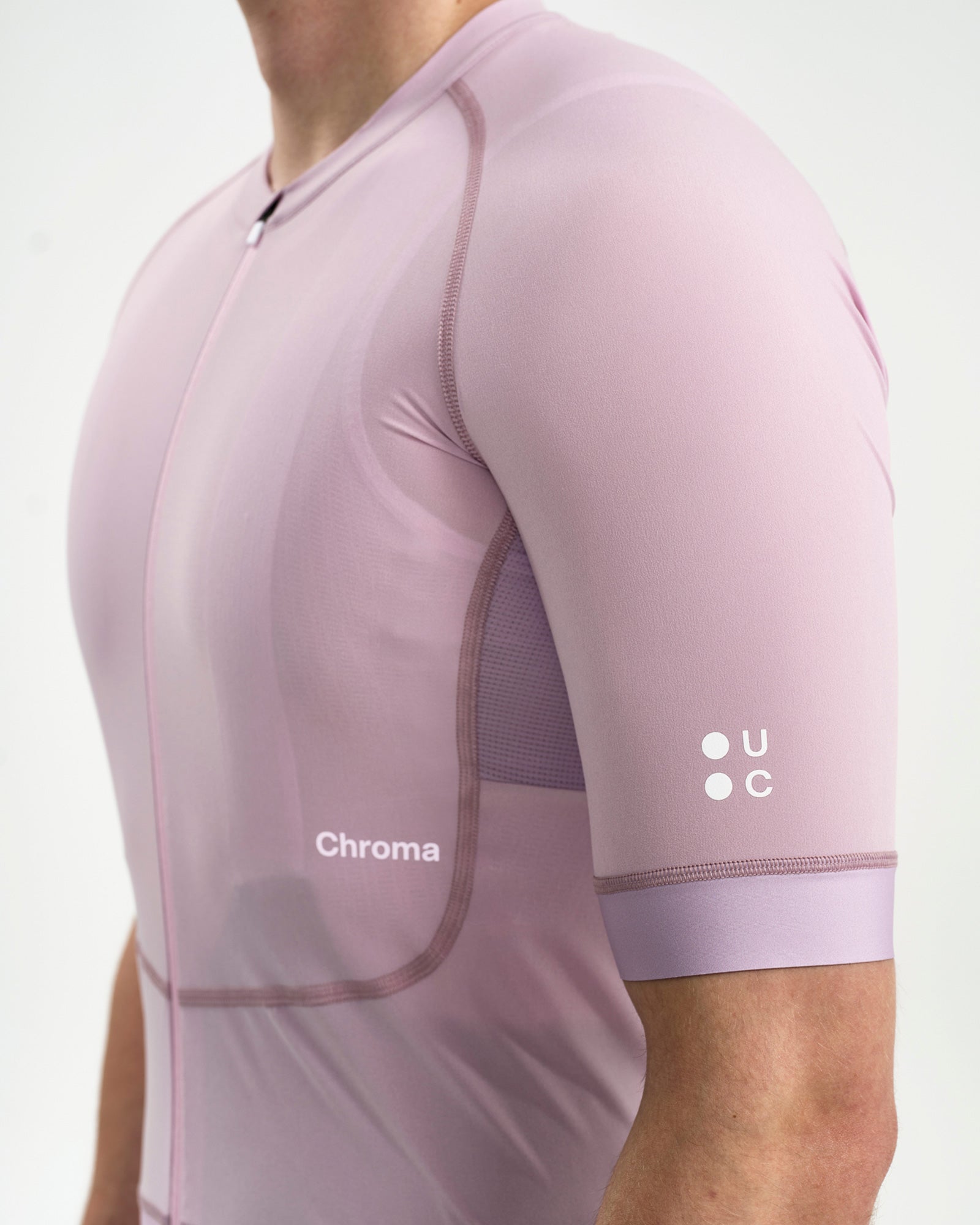 Right-side detail: UC roundel on the sleeve cuff and tonal Chroma chest wordmark on the Washed Lilac Chroma Jersey.