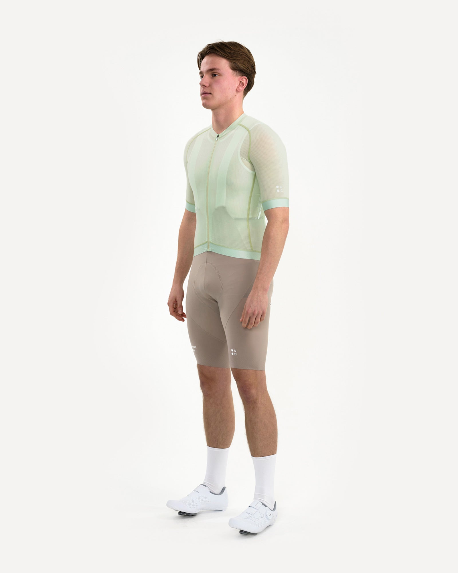 Three-quarter front of the Men's Chroma Light Jersey in Bower Green, with tonal UC dots logo on the right sleeve.