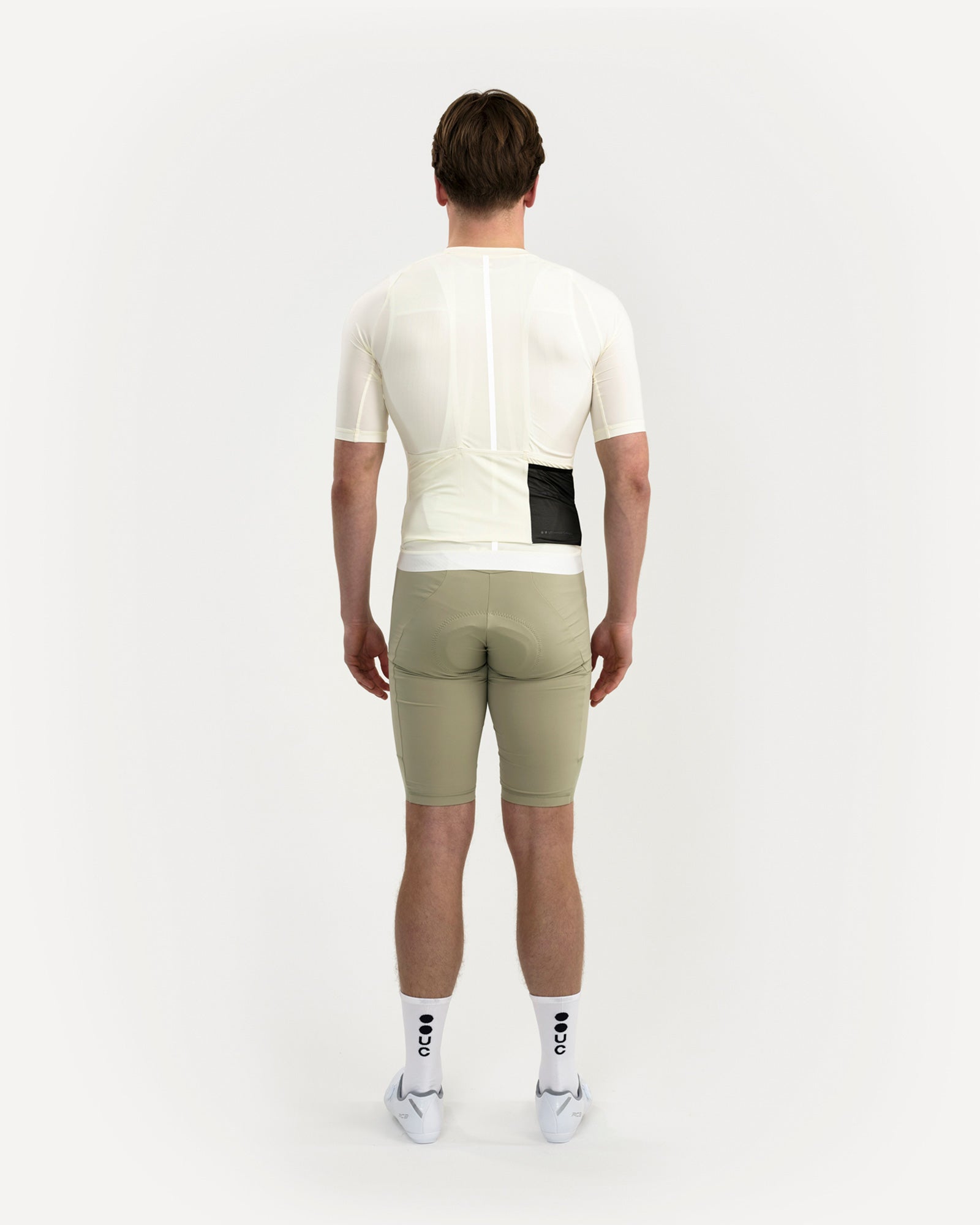 Back view: Men's Mono Short Sleeve Jersey in Tampered White with reflective spine stripe and zipped rear valuables pocket.