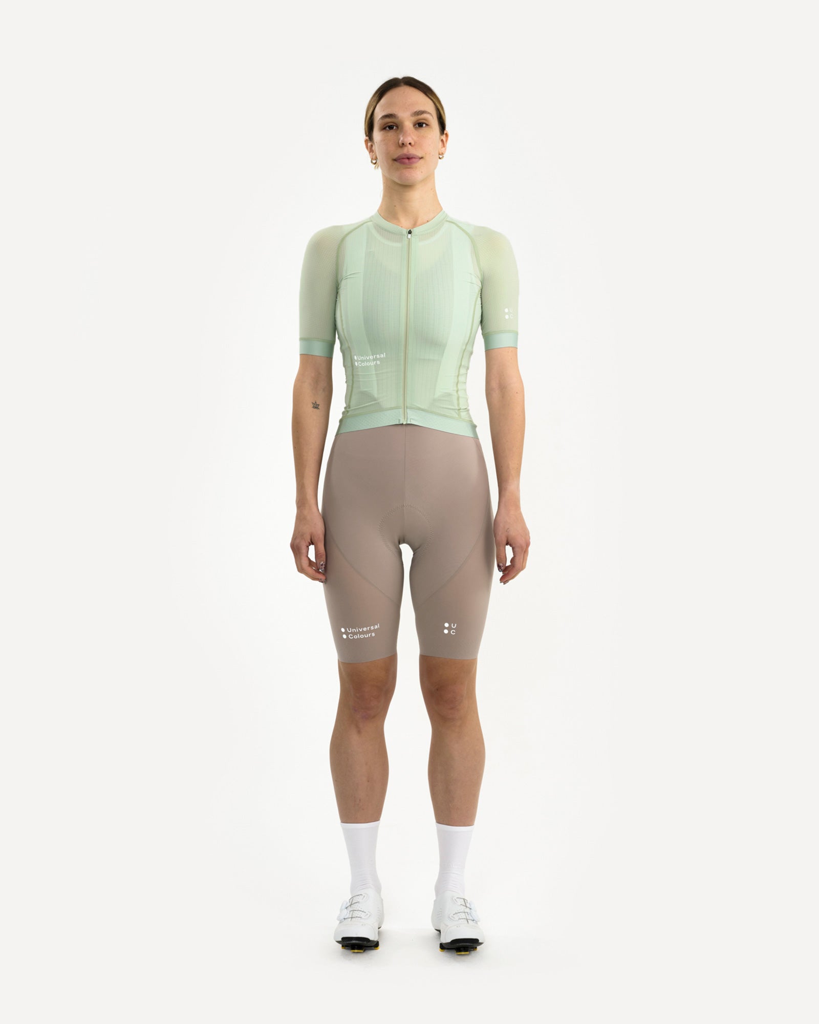 Model wearing the Women's Chroma Light Short Sleeve Jersey in Bower Green, front view, with mushroom bib shorts.