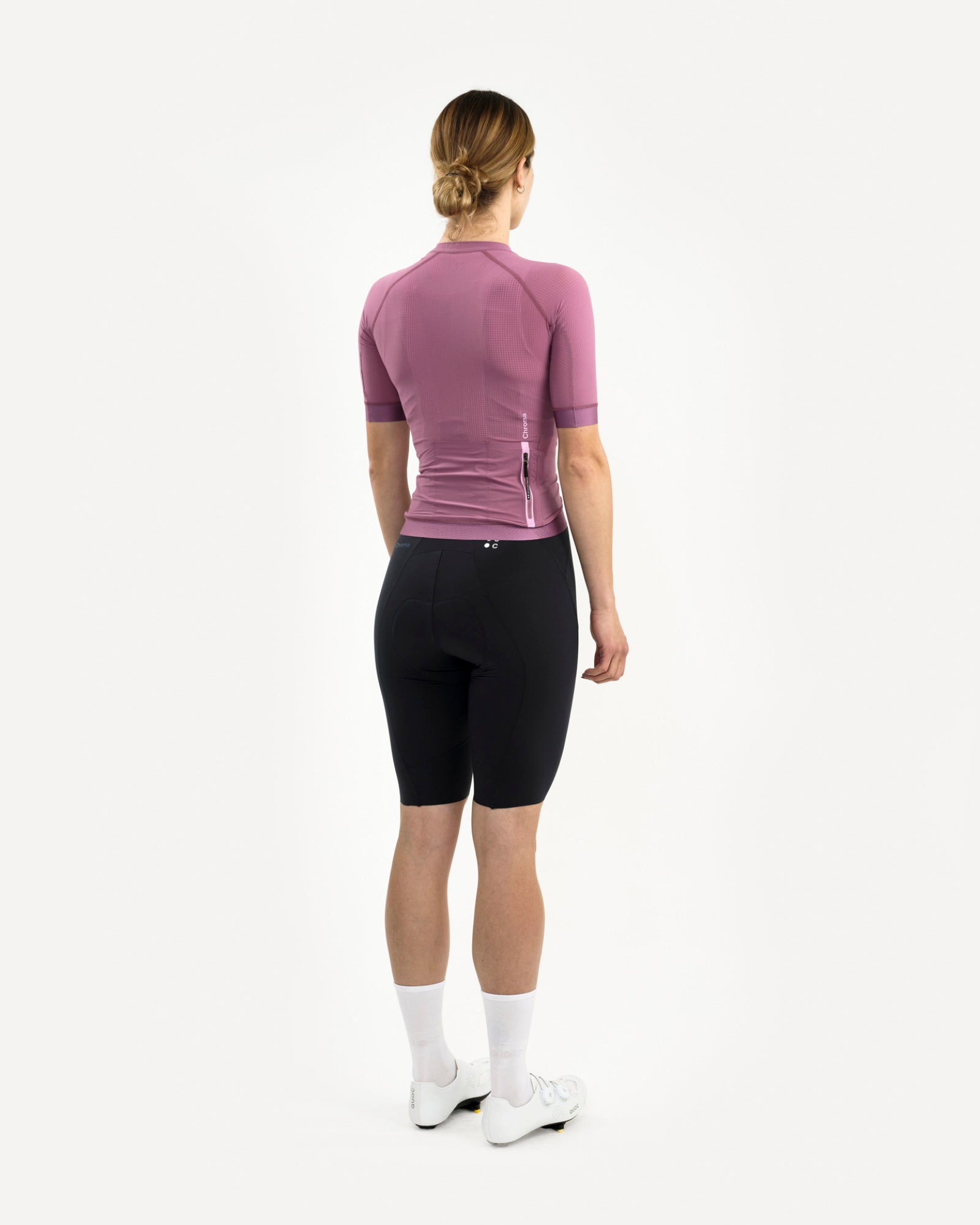 Back three-quarter: Women's Chroma Light Jersey in Dusty Lilac, pink-tab zipped rear pocket and tonal Chroma wordmark.