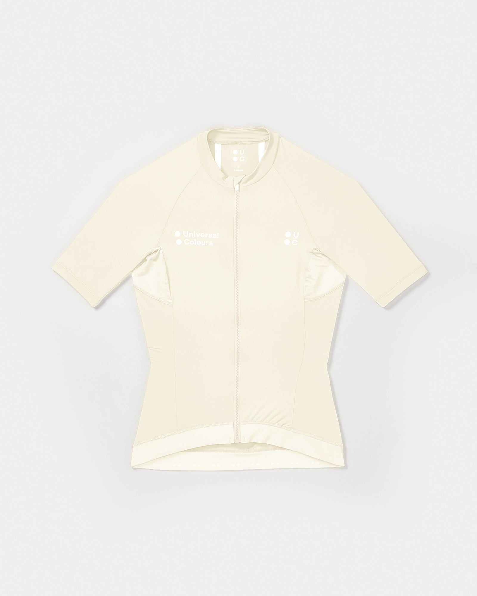 Flatlay of the Women's Mono Short Sleeve Jersey in Tampered White: high collar, full-length zip and tonal UC chest logos.