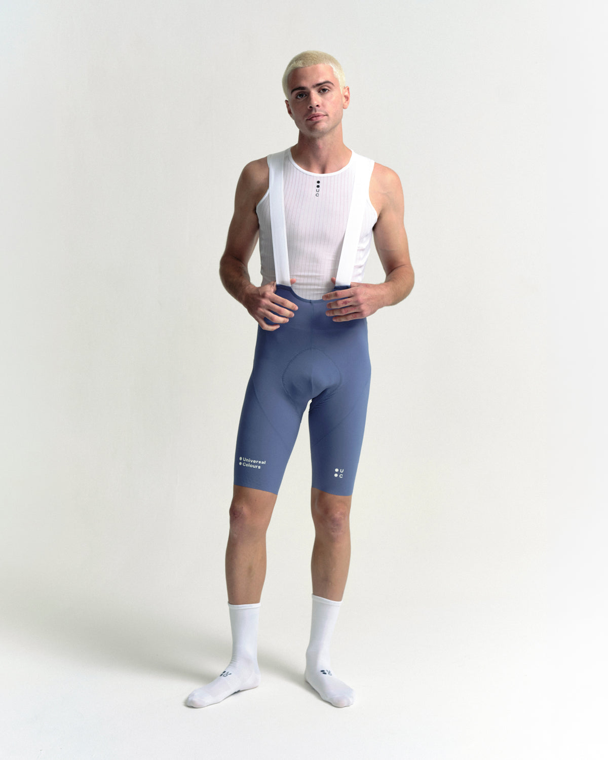Model standing in the Men's Chroma Bib Shorts in Slate Blue, front view.