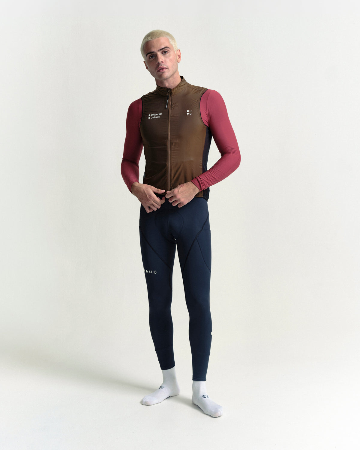 Model in the Men's Spectrum Gilet 2.0 in Honey Gold, full-length view.