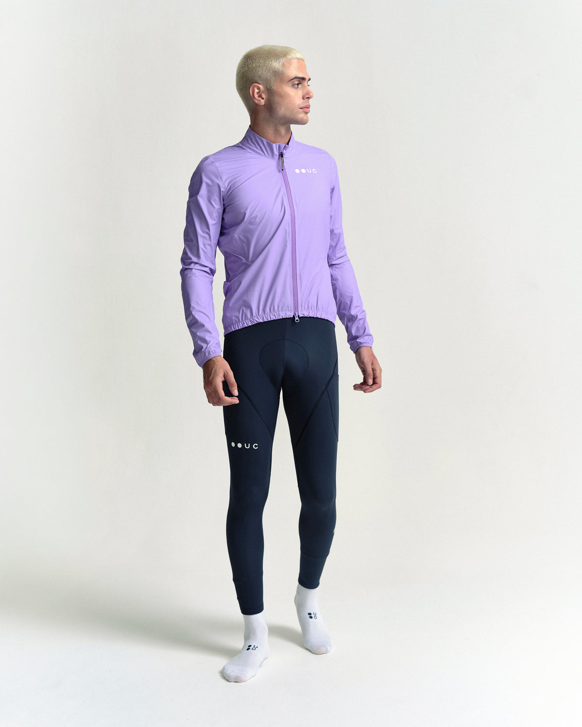 Model wearing the Men's Mono Rain Jacket in Cloud Lilac.