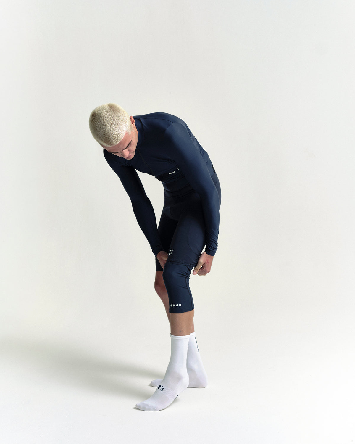 Model in the Knee Warmers in Eclipse Navy, full-length view.