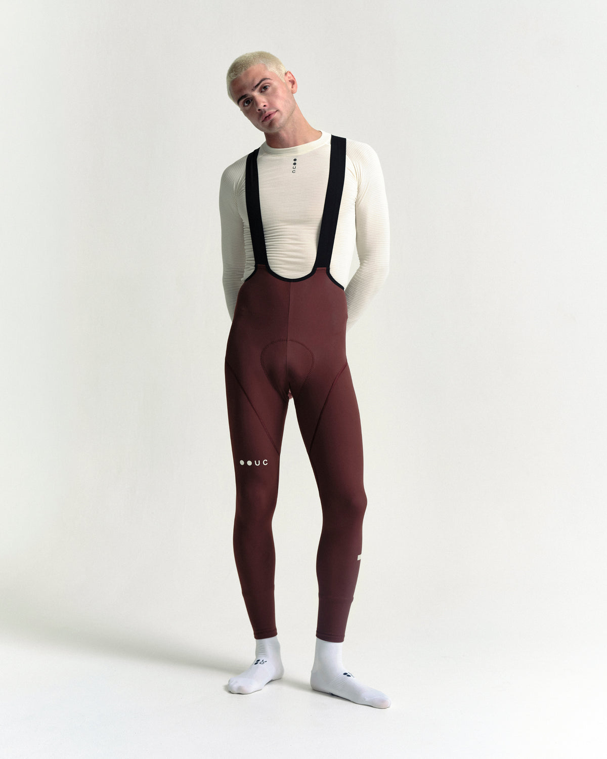 Model wearing the Men's Mono Bib Tight in Deep Red.