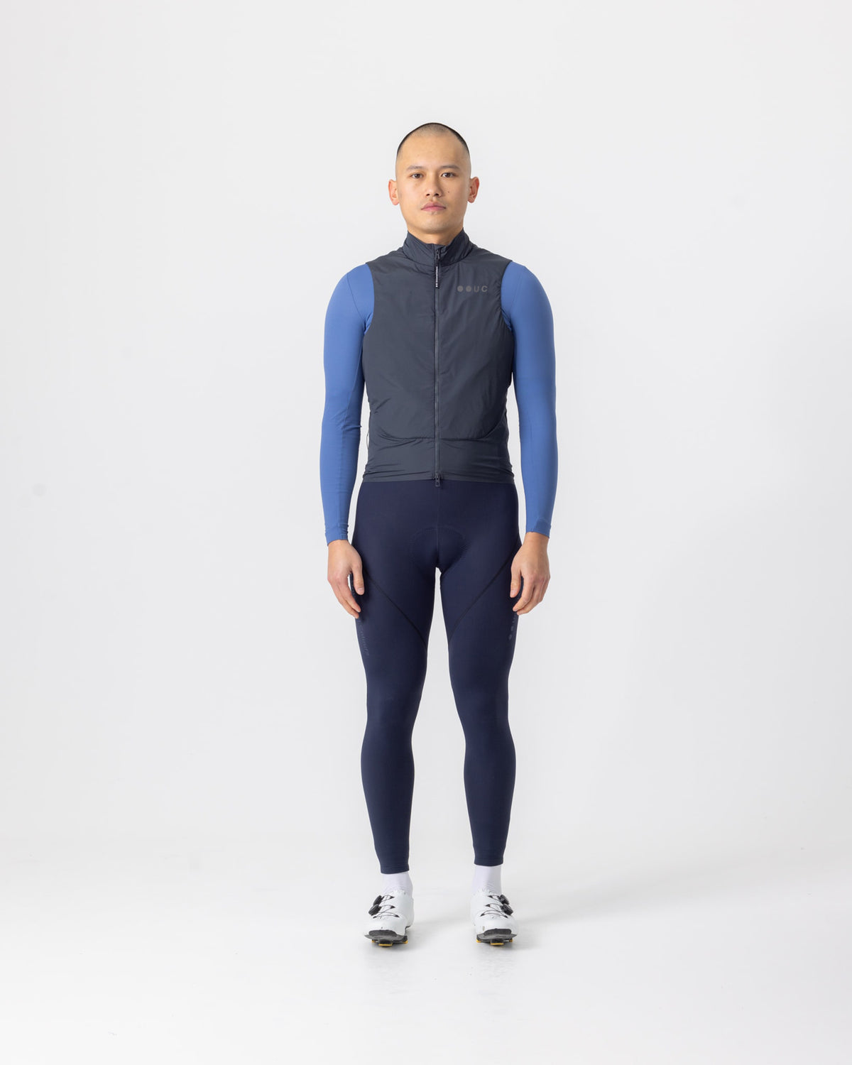Model in the Men's Chroma Insulated Gilet in Slate Grey, full-length view.