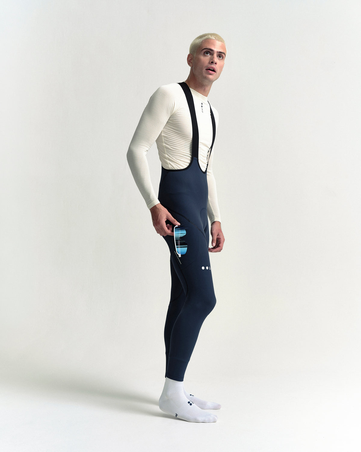 Model wearing the Men's Mono Cargo Bib Tight in Eclipse Navy.