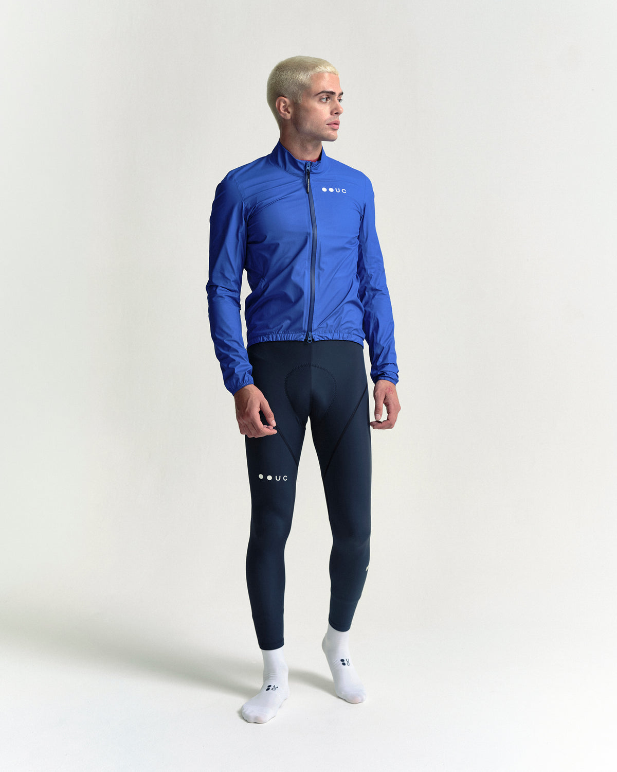 Model wearing the Men's Mono Rain Jacket in Vivid Blue.