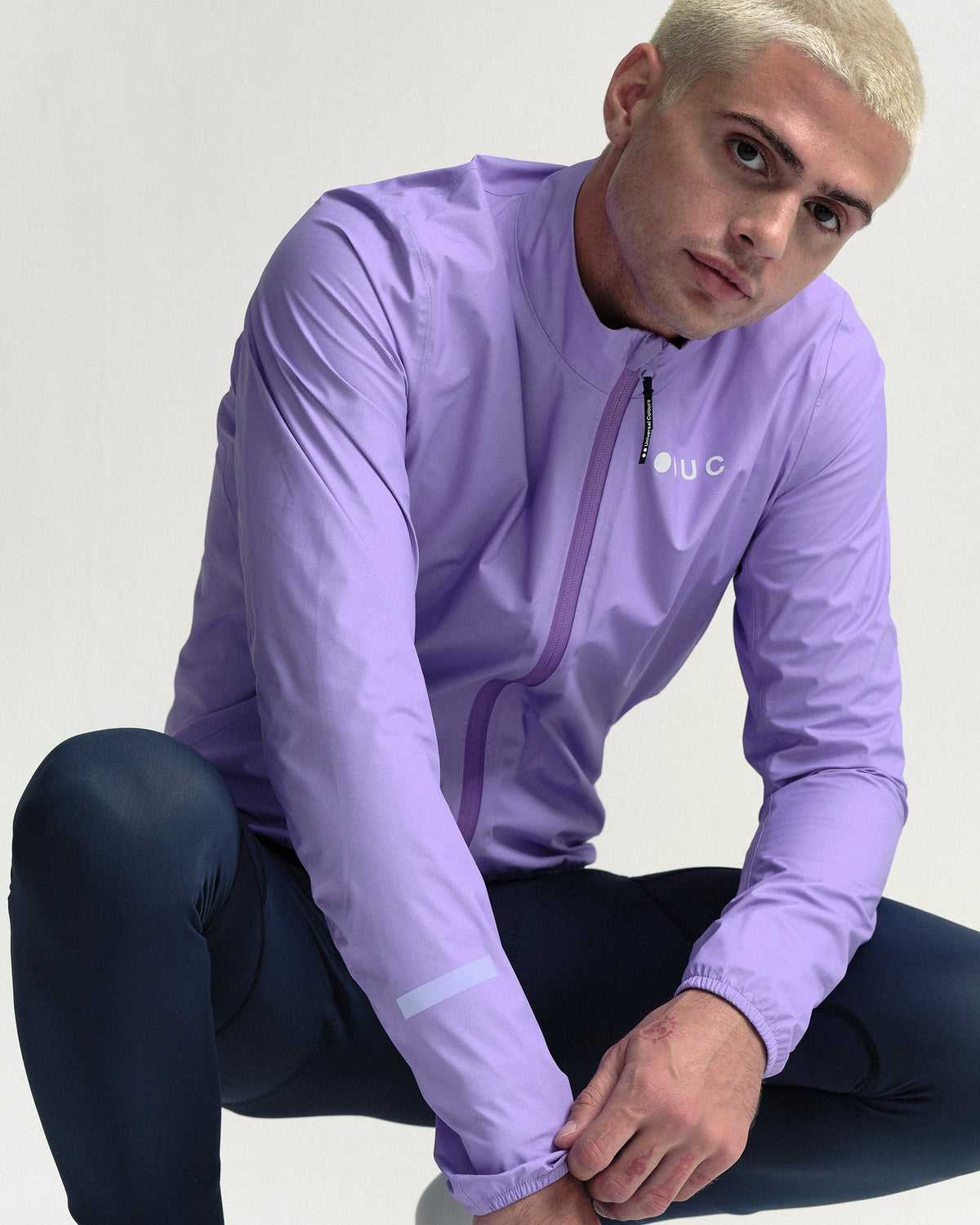 Model wearing the Men's Mono Rain Jacket in Cloud Lilac.