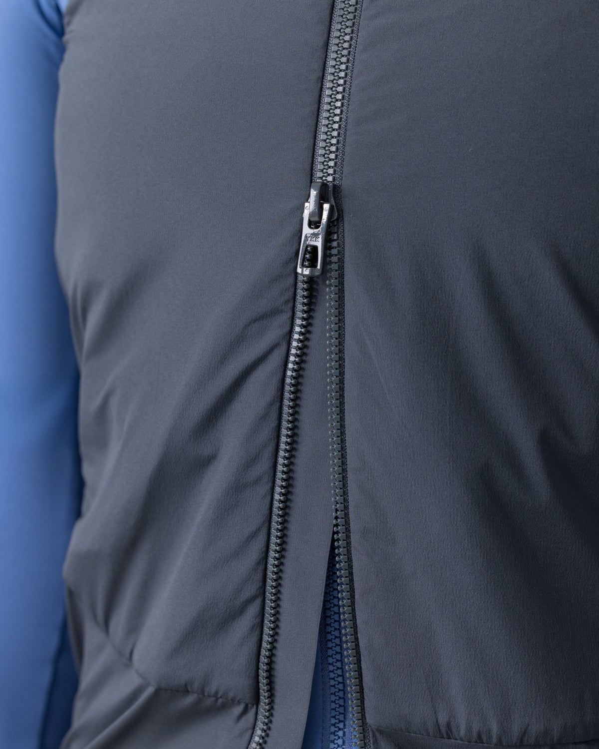 Close-up of the two-way zip on the Men's Chroma Insulated Gilet in Slate Grey.