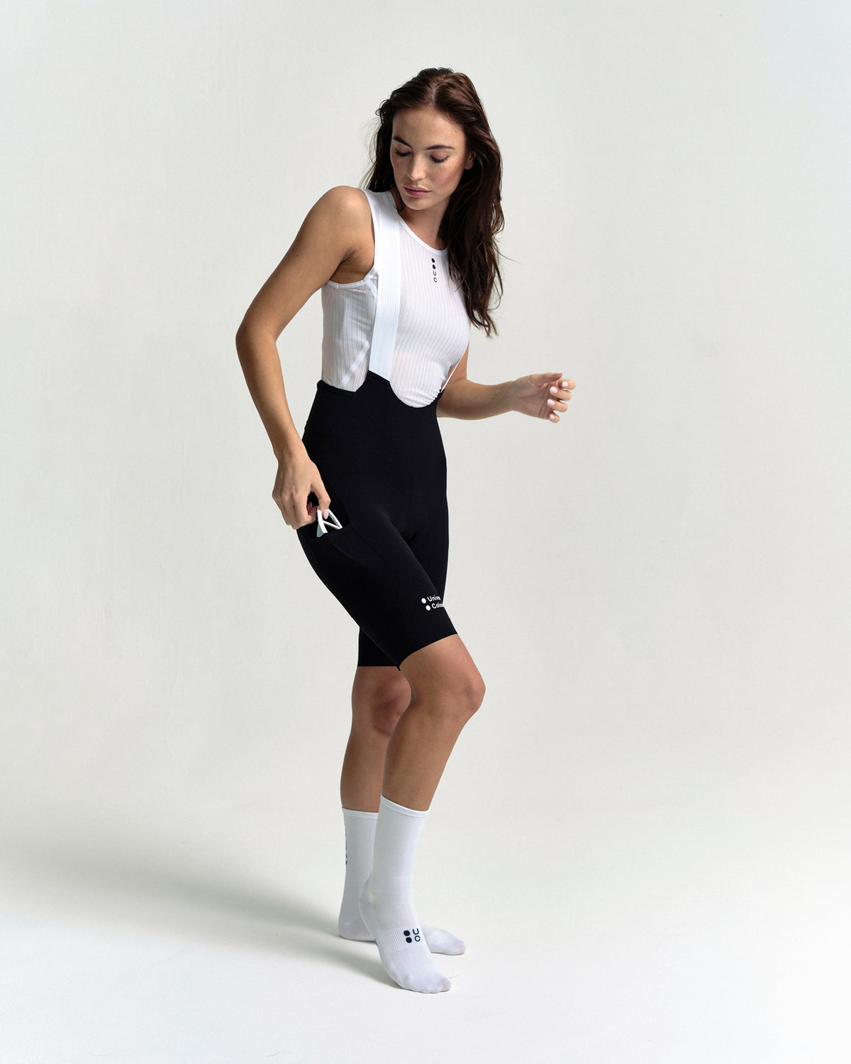 Model wearing the Women's Chroma Cargo Bib Shorts in Black.