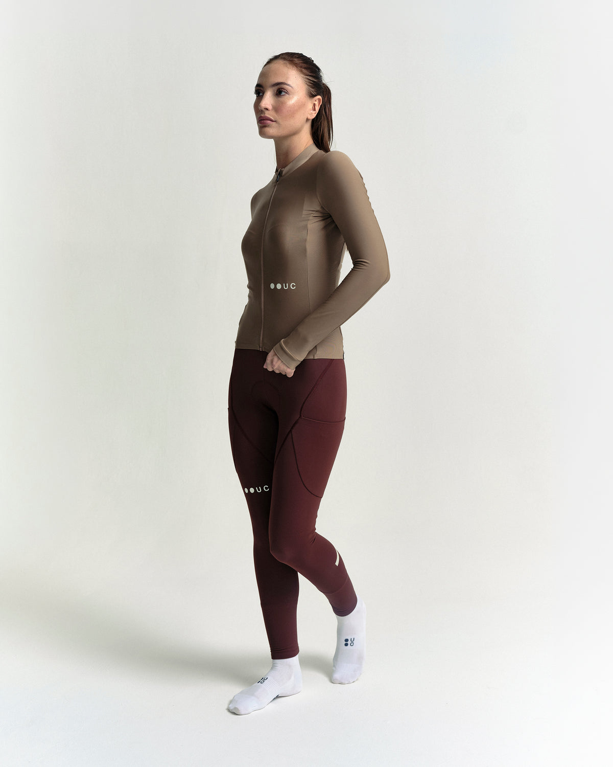 Model in the Women's Mono Long Sleeve Jersey in Walnut Brown, full-length view.