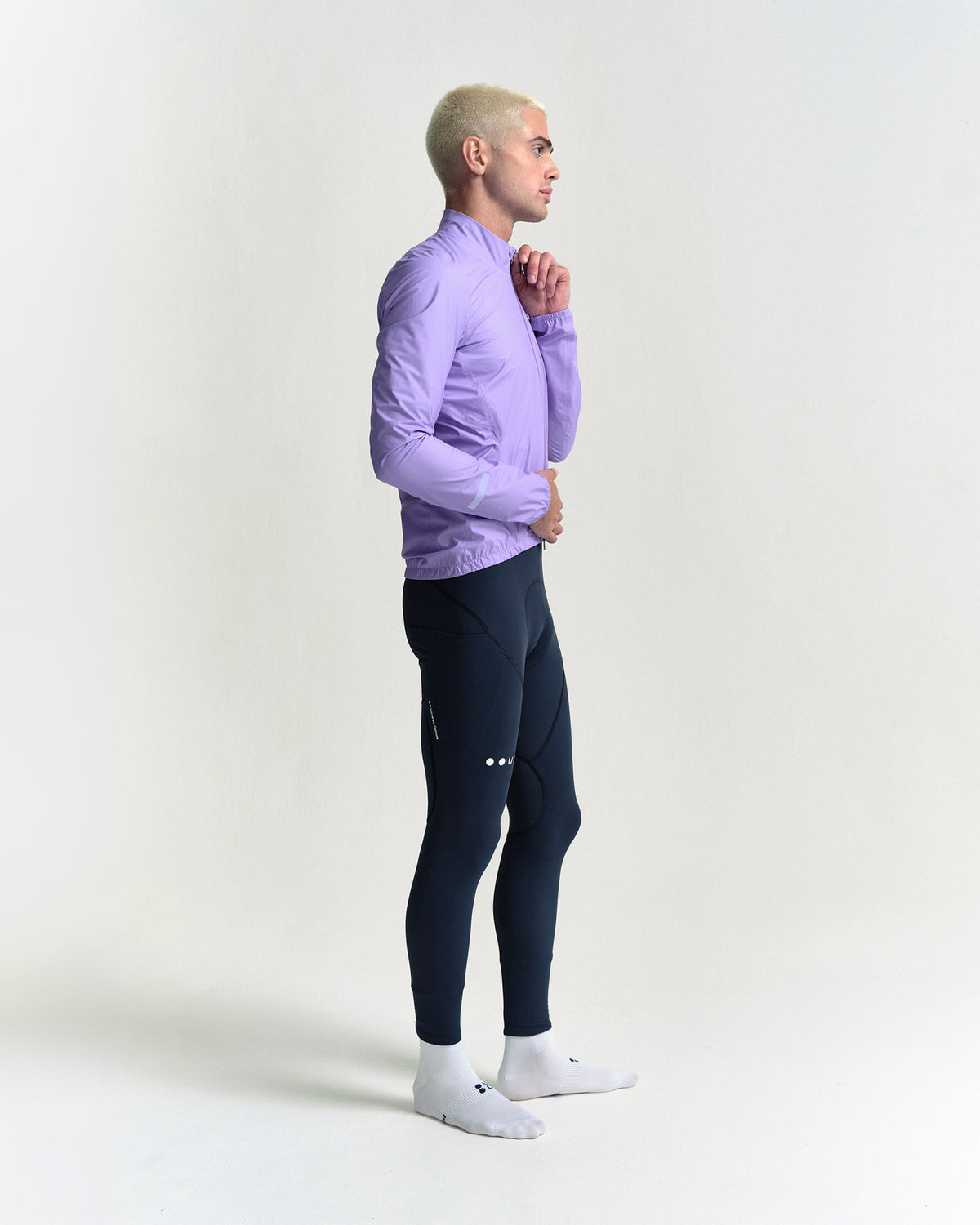 Model wearing the Men's Mono Rain Jacket in Cloud Lilac.