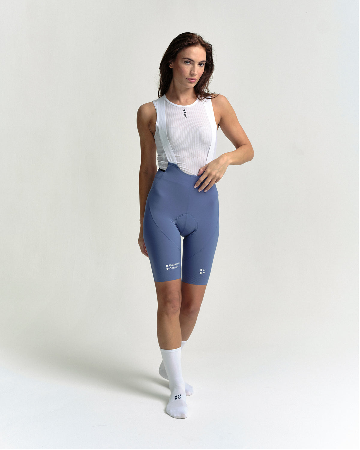 Model wearing the Women's Chroma Bib Shorts in Slate Blue.