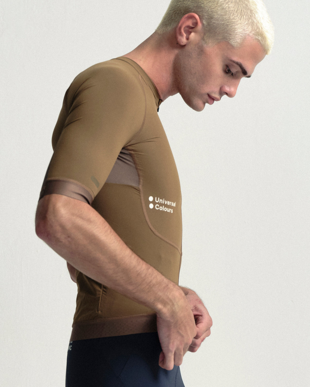 Model wearing the Men's Chroma Short Sleeve Jersey in Golden Brown.