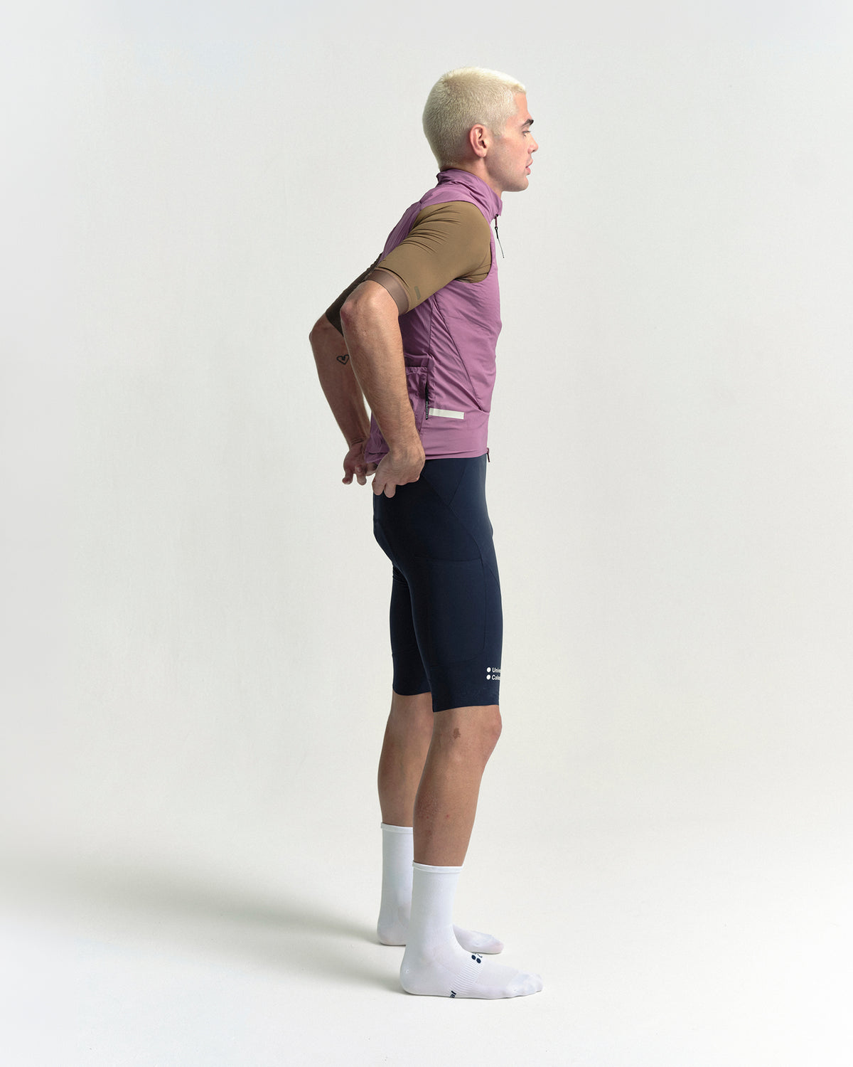 Model wearing the Men's Chroma Insulated Gilet in Dusty Rose.