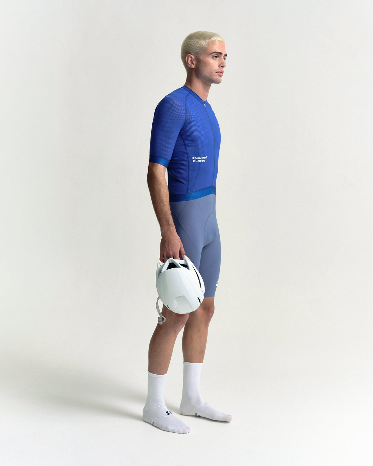 Model wearing the Men's Chroma Light Short Sleeve Jersey in Vivid Blue.