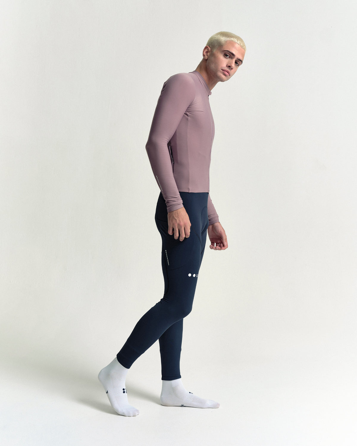 Model in the Men's Mono Long Sleeve Jersey in Mauve Mist, full-length view.