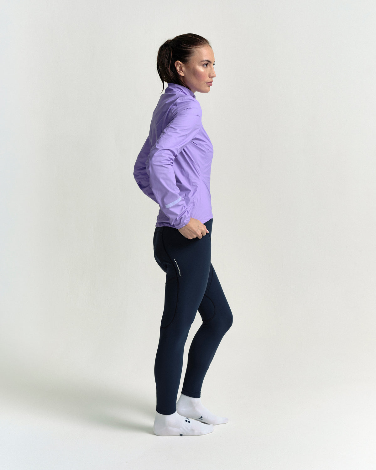 Model in the Women's Mono Rain Jacket in Cloud Lilac, side view.
