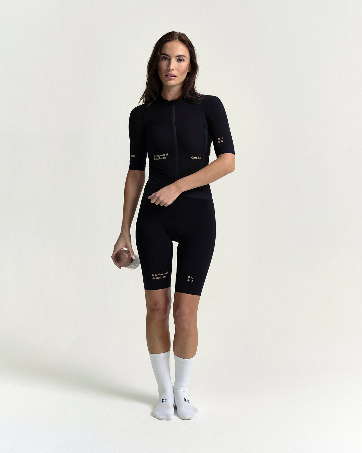 Model wearing the Women's Chroma Short Sleeve Jersey in Black/Bronze.