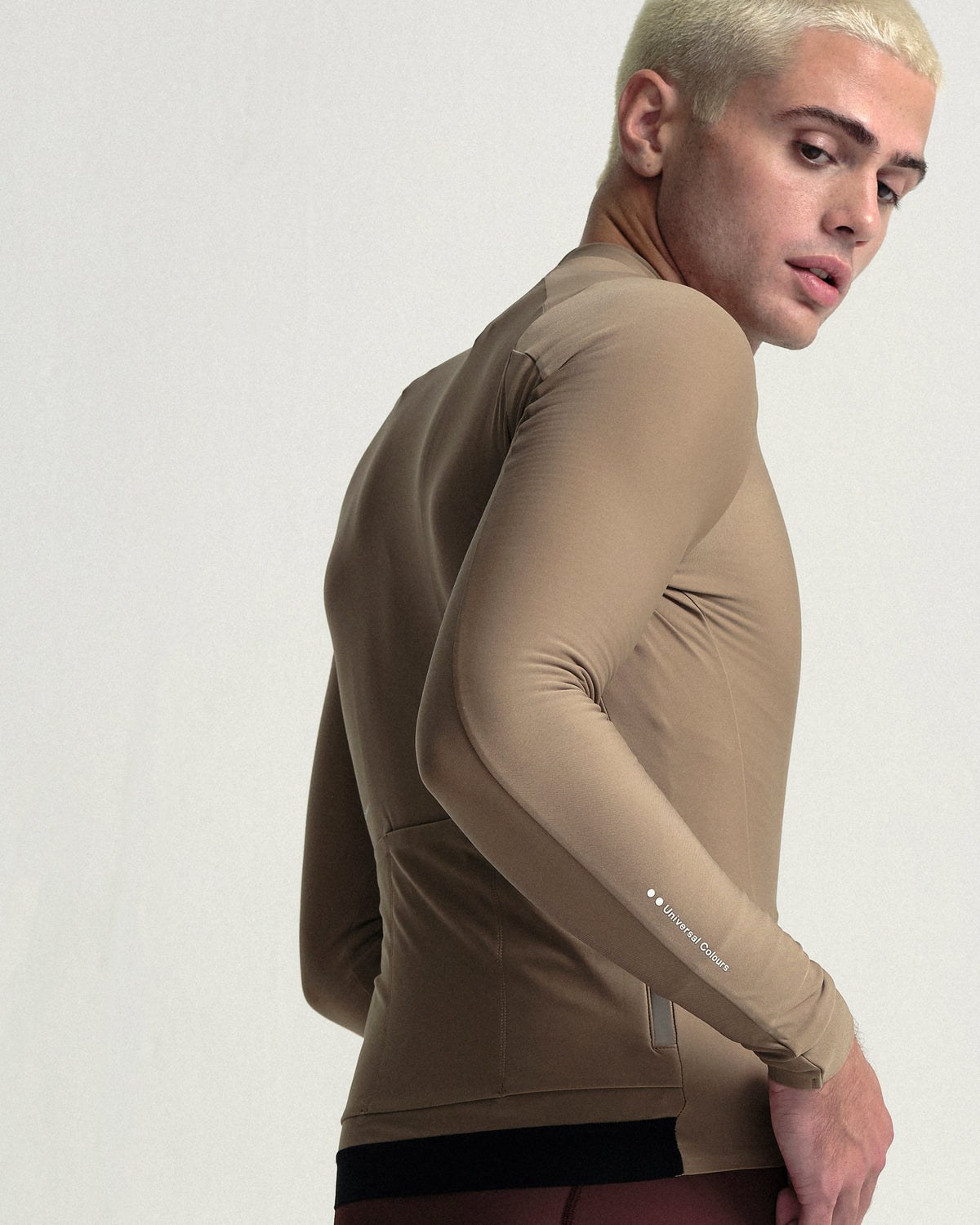 Model wearing the Men's Mono Long Sleeve Jersey in Walnut Brown.