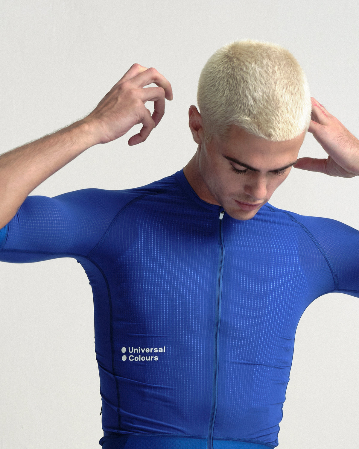 Model wearing the Men's Chroma Light Short Sleeve Jersey in Vivid Blue.