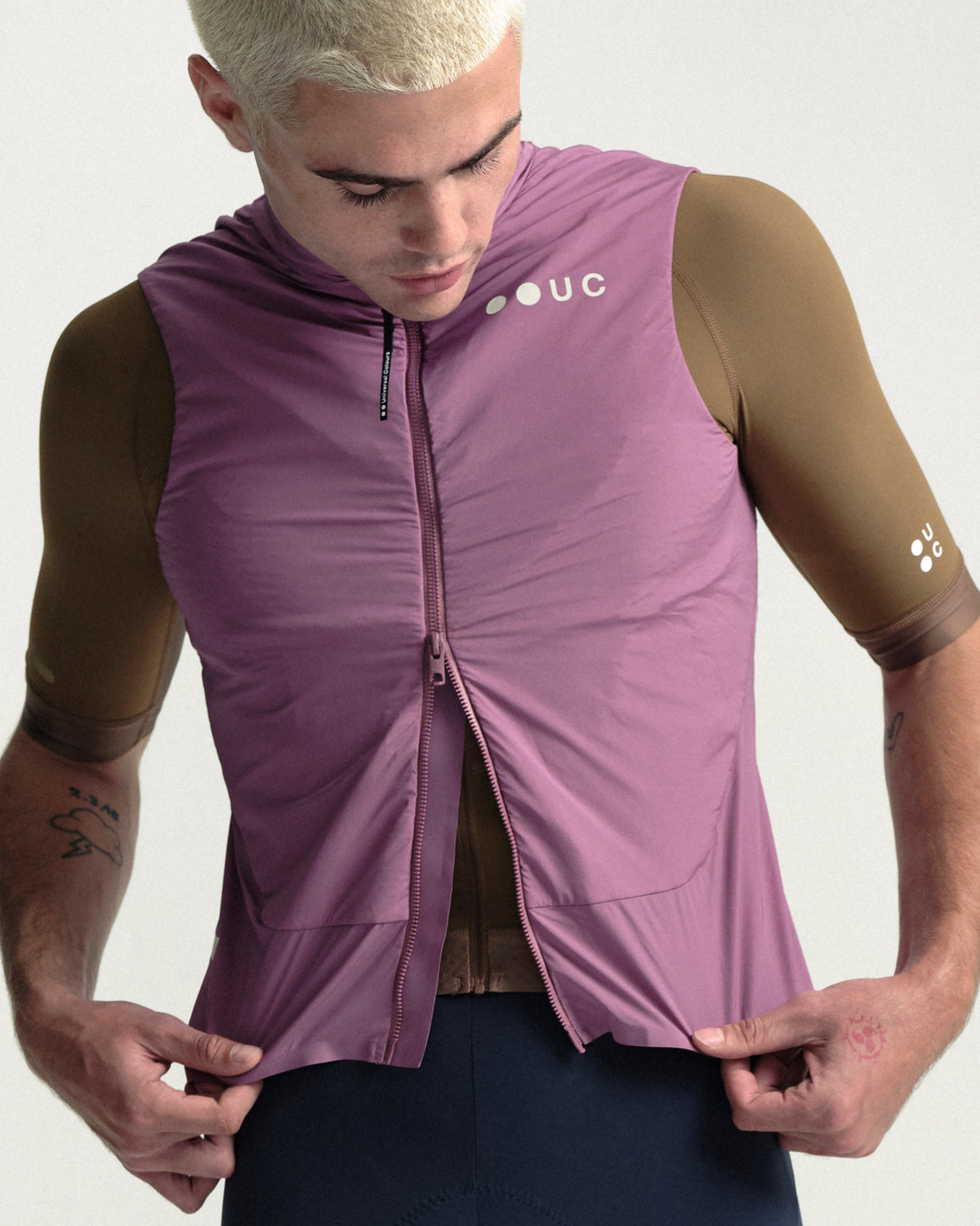 Model wearing the Men's Chroma Insulated Gilet in Dusty Rose.