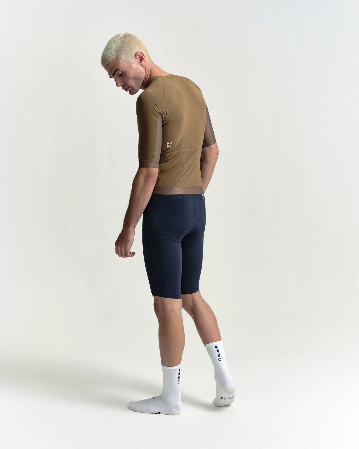 Model wearing the Men's Chroma Short Sleeve Jersey in Golden Brown.