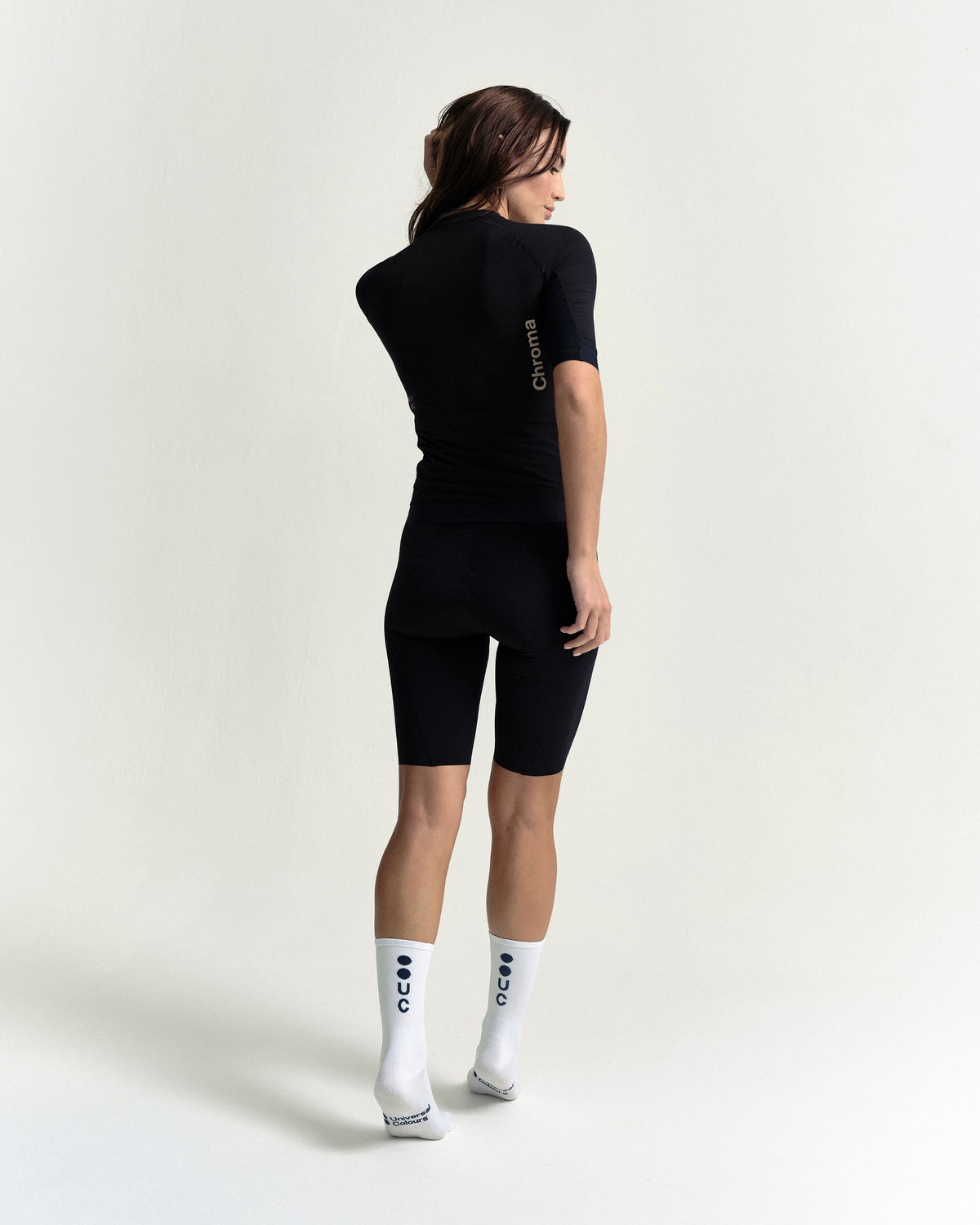 Model wearing the Women's Chroma Short Sleeve Jersey in Black/Bronze.