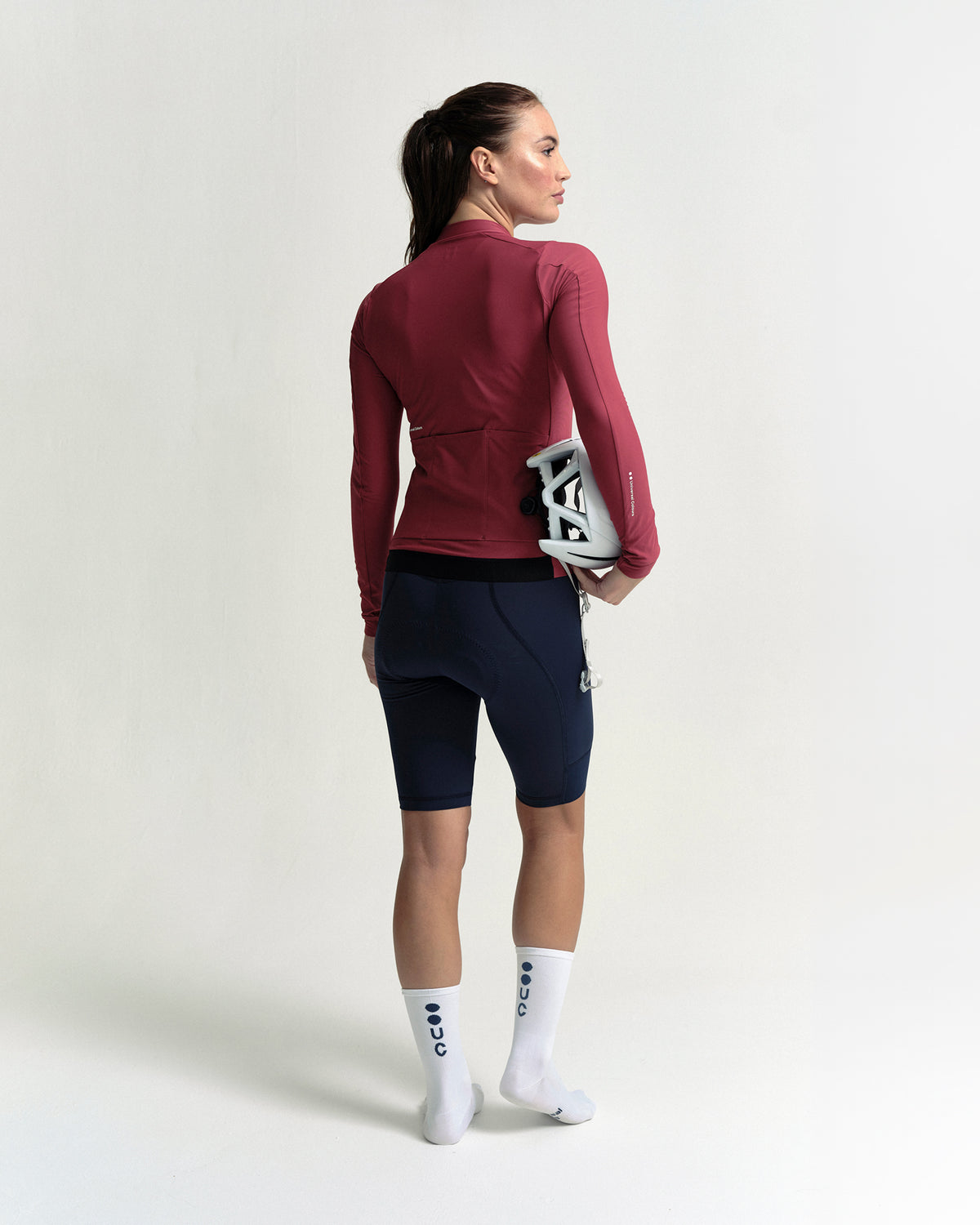Model wearing the Women's Mono Long Sleeve Jersey in Apple Red.