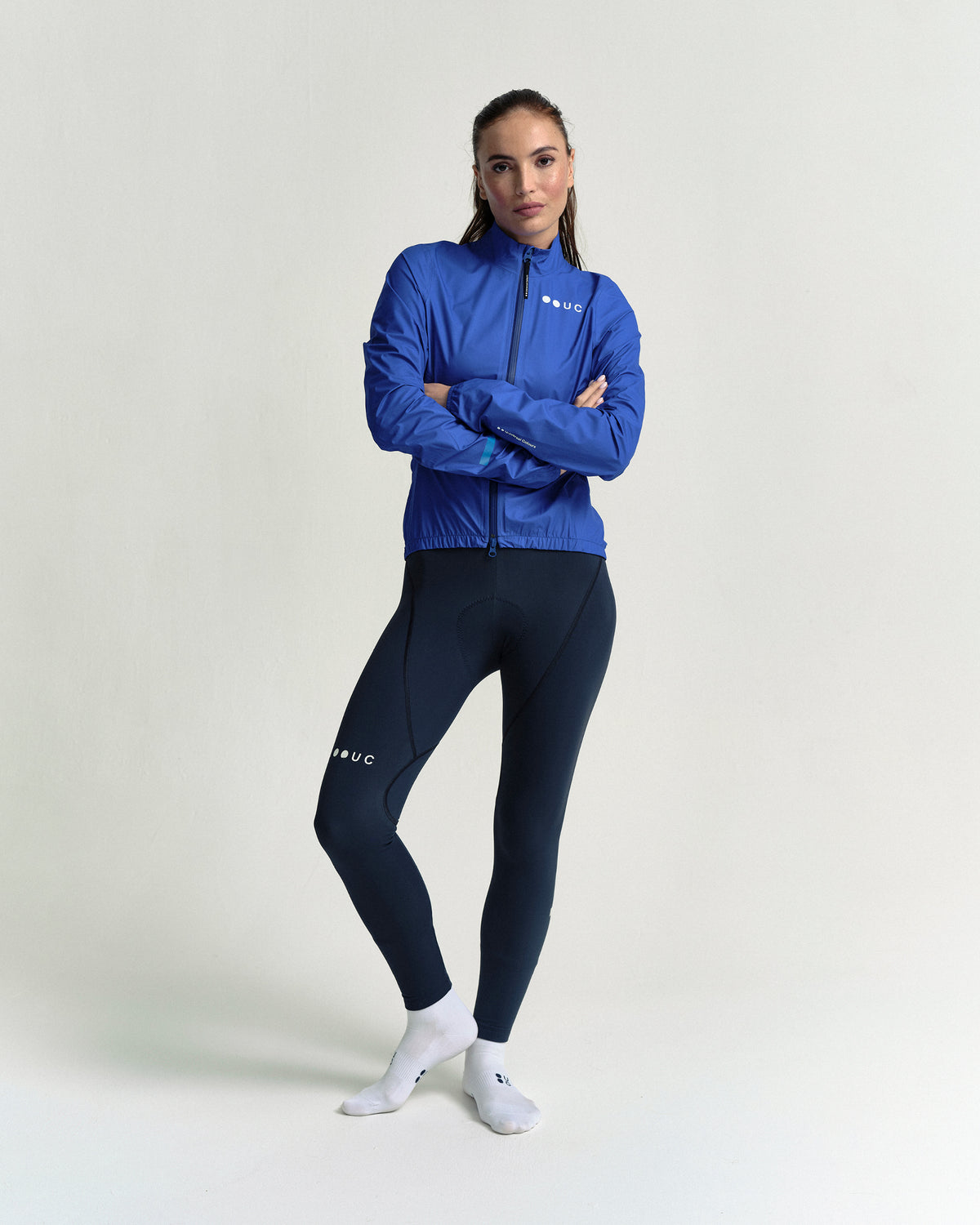 Model wearing the Women's Mono Rain Jacket in Vivid Blue.