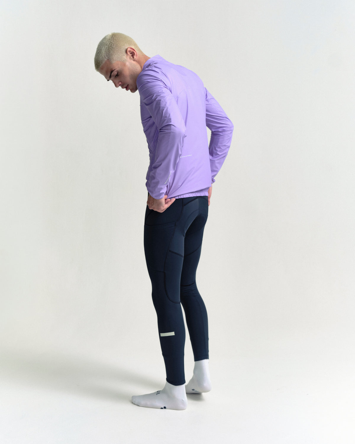 Model wearing the Men's Mono Rain Jacket in Cloud Lilac.