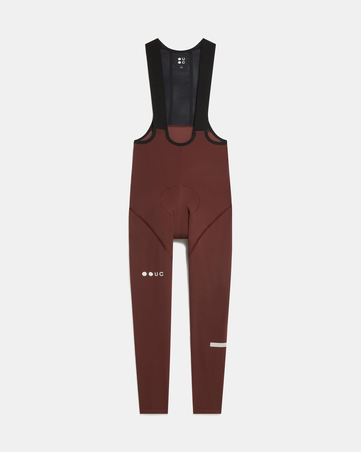 Flatlay of the Men's Mono Bib Tight in Deep Red: mesh bib straps, contoured chamois and UC thigh logo.