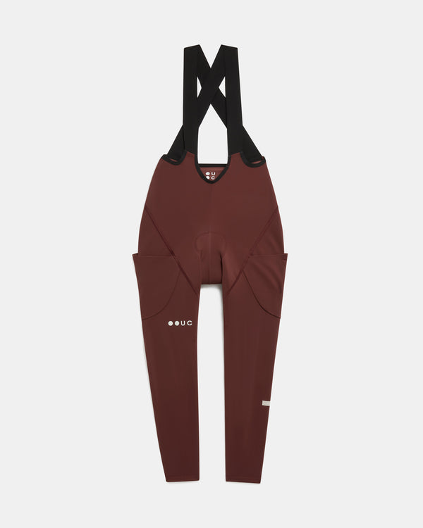 Women's Mono Cargo Bib Tight in Deep Red, flatlay front view: crossover straps and twin stretch thigh cargo pockets.