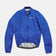 Flatlay of the Men's Mono Rain Jacket in Vivid Blue: ripstop shell, full-length zip and UC chest logo.