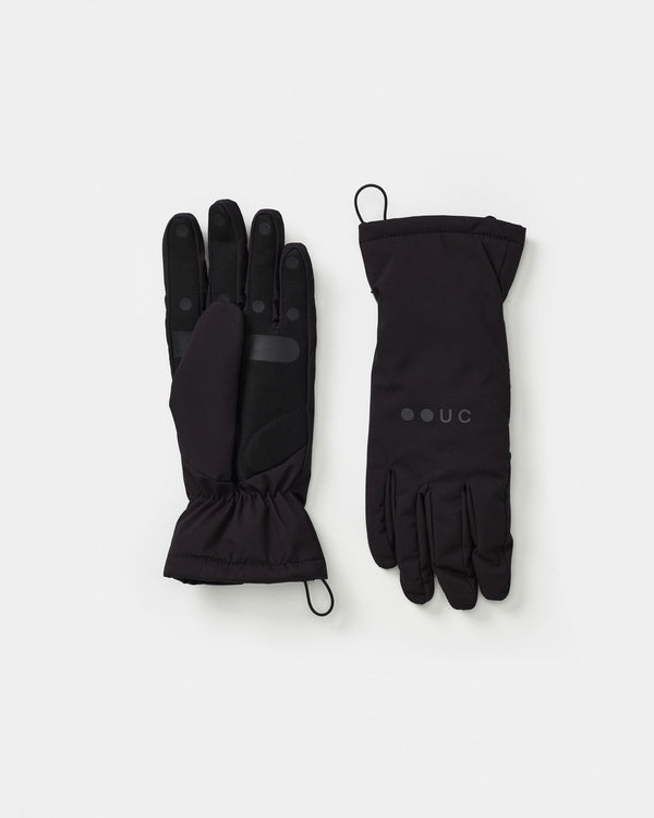Flatlay of the Deep Winter Gloves in Black: palm with grip dots and reflective bar; back of hand with tonal UC logo.