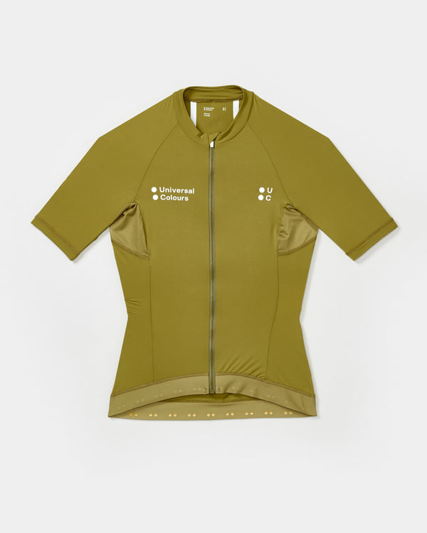 Women's Mono Short Sleeve Jersey in Olive Gold flatlay, front view: full-length zip, UC chest logo and side mesh panels.