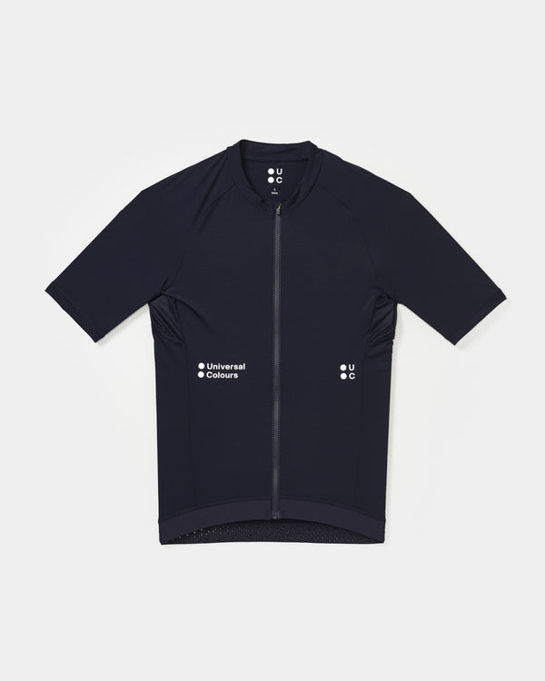 Flatlay of the Men's Mono Short Sleeve Jersey in Navy Blue: mock collar, full-length zip and white UC chest logos.
