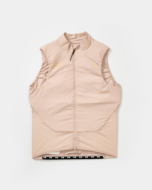 Flatlay of the Unisex Chroma Insulated Gilet in Almond Beige: high collar, full-length zip and gold UC chest logo.