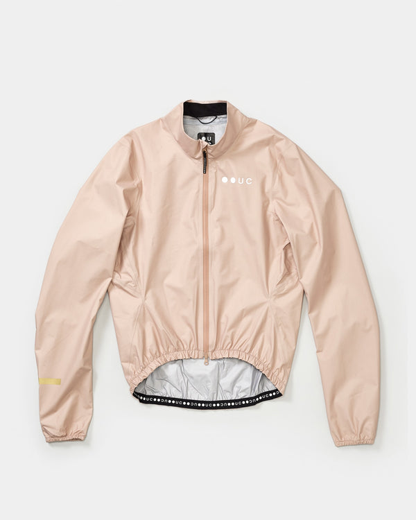 Flatlay of the Men's Mono Rain Jacket in Almond Beige, full-length zip, tonal UC logo and dropped elasticated hem.