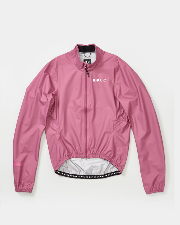 Men's Mono Rain Jacket in Soft Pink, flatlay front view, showing high collar, full-length zip and white UC chest logo.