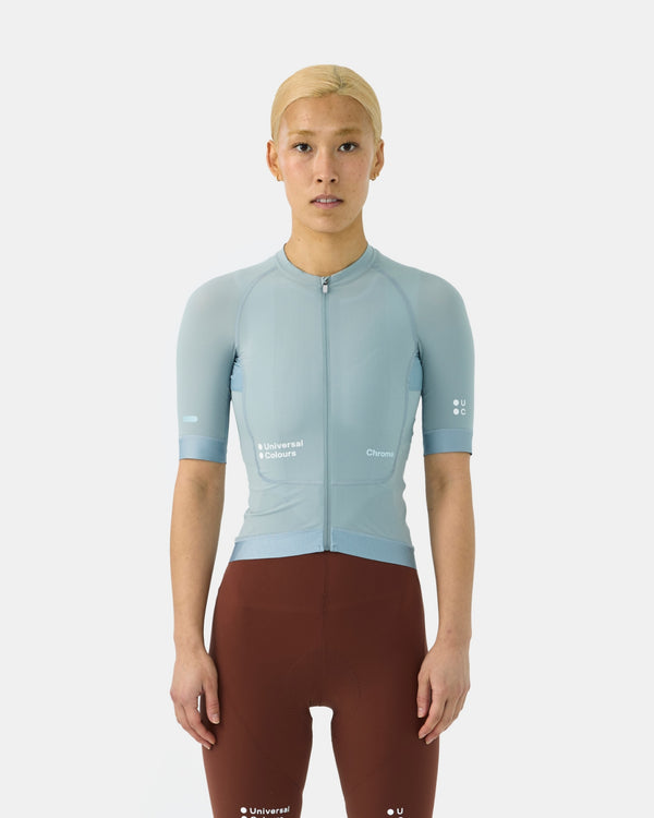 Model wearing the Women's Chroma Short Sleeve Jersey in Sky Blue, paired with Mosswood Brown bib shorts, front view.